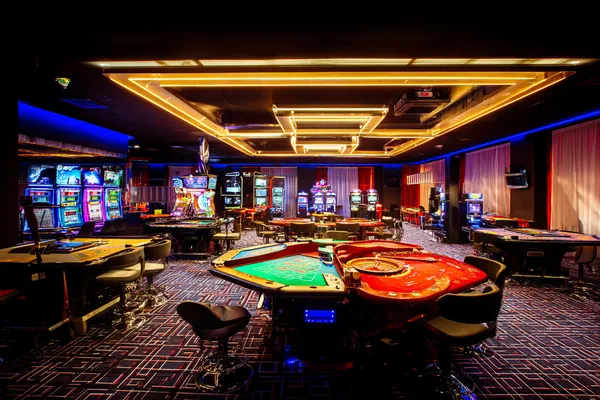 A player using their smartphone during a festive local event, representing CD444’s fully mobile-friendly casino.